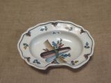 a small plate with a comb and a comb on it