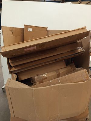 a pile of cardboard boxes sitting on top of each other
