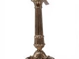 a close up of a metal candle holder on a white background