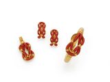 a set of three gold and red jewelry pieces