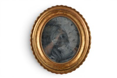 a gold frame with a picture of a woman in it