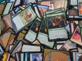 many different types of cards scattered on the floor