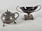 three silver plated items including a teapot, saucer, and spoon