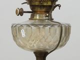 a glass lamp that is sitting on a table
