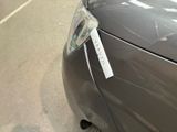 a close up of a car with a sticker on it ' s hood