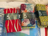 several different colored napkins are sitting on a table next to each other
