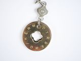 an image of a keychain with a coin attached to it