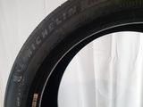 a close up of a tire on a table with a white background