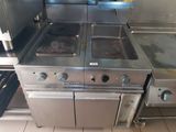 a large kitchen with a lot of stainless steel appliances