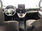 the interior of a car with a steering wheel, dashboard, and dashboard controls