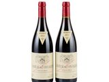 two bottles of red wine sitting next to each other on a white surface