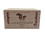 a wooden box with a label on it that says chateau la chandeliere