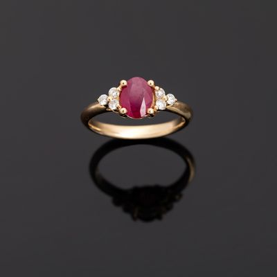 an oval ruby and diamond ring