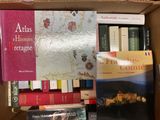 many books in a box on the table