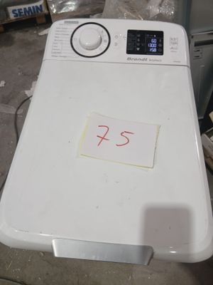 a white washing machine with a price tag on it