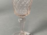 a glass cup that is sitting on a table