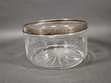 an image of a glass jar with a gold lid on a gray surface