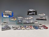 many different models of cars on display in a display case