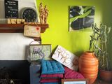 a room with a fire place and a bunch of pictures on the wall