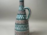 a blue and white vase with a pattern on it
