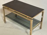 a coffee table with a glass shelf on top of it