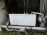 a white box with a water heater inside of it