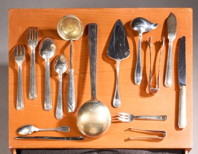 a wooden tray with silverware and spoons on it