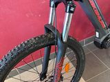 a bike that is parked in front of a red wall