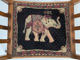 a picture of an elephant on the back of a chair
