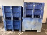 two blue crates sitting next to each other in a garage