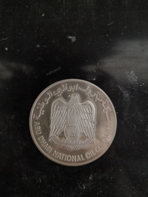 une image représentant une pièce d'argent sur laquelle figure un aigle