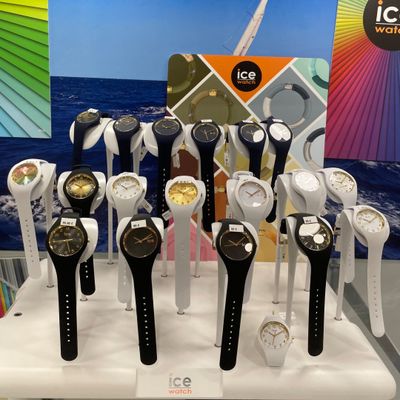 a lot of watches that are on display on a table