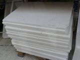 a pile of white paper stacked on top of a pallet