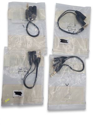 four different types of cables and cords in bags on a white surface