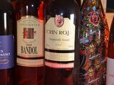 several bottles of wine are lined up on a table