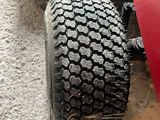a close up of a tire on a lawn mower