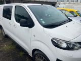 a picture of a white van parked in a parking lot