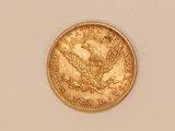 a close up of a gold coin with an eagle on it