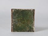 an image of a green square shaped object on a white surface