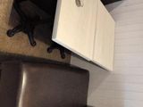 an overhead view of a desk and a chair in a room