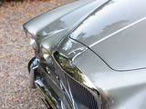 a close up view of a car ' s front grill and hood