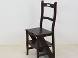 a small wooden chair that is sitting in a room