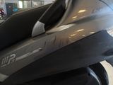 a close up view of a motorcycle in a showroom