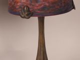 a lamp that has a pink shade on it