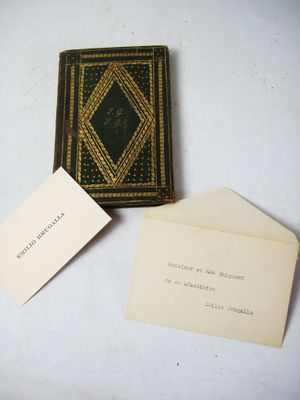 a small book and a small card on a table