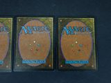 two decks of magic the gathering are sitting on a table