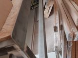 several pieces of wood are stacked on top of each other in a room