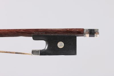 a close up of a violin bow on a white background