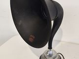 a black lamp that is on a white table