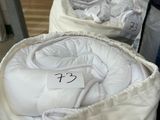 two bags of bedding sitting on a table